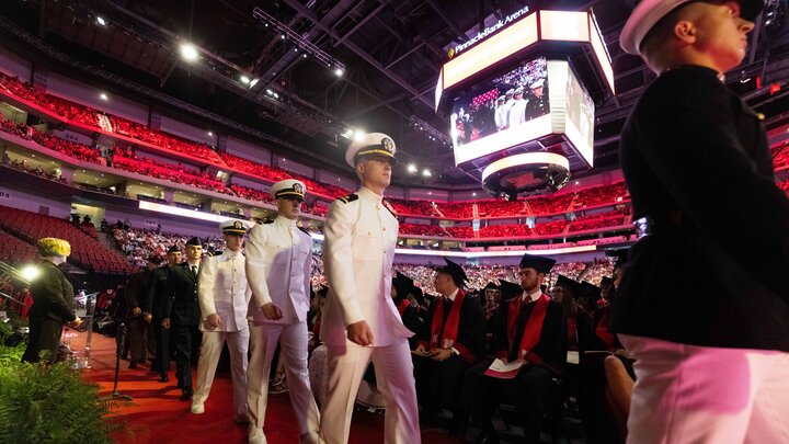 Air Force, Army and Naval ROTC members march to the Pinnacle Bank Arena stage to recite the oath of enlistment during the afternoon undergraduate commencement ceremony May 17 at Pinnacle Bank Arena.